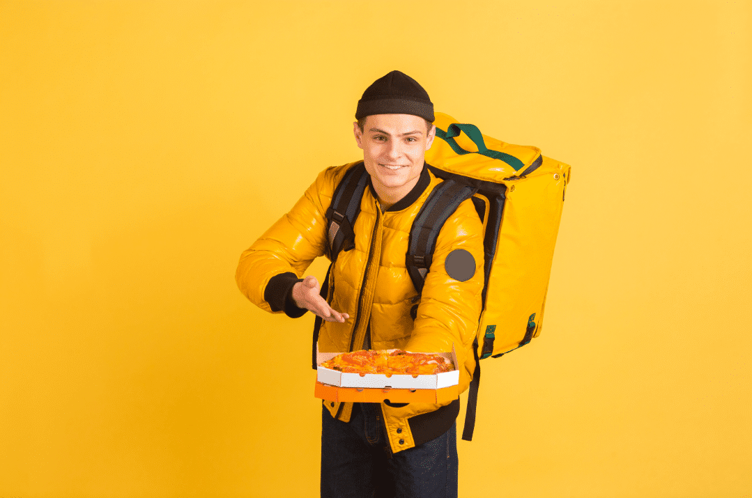 A man with a food order with yellow background