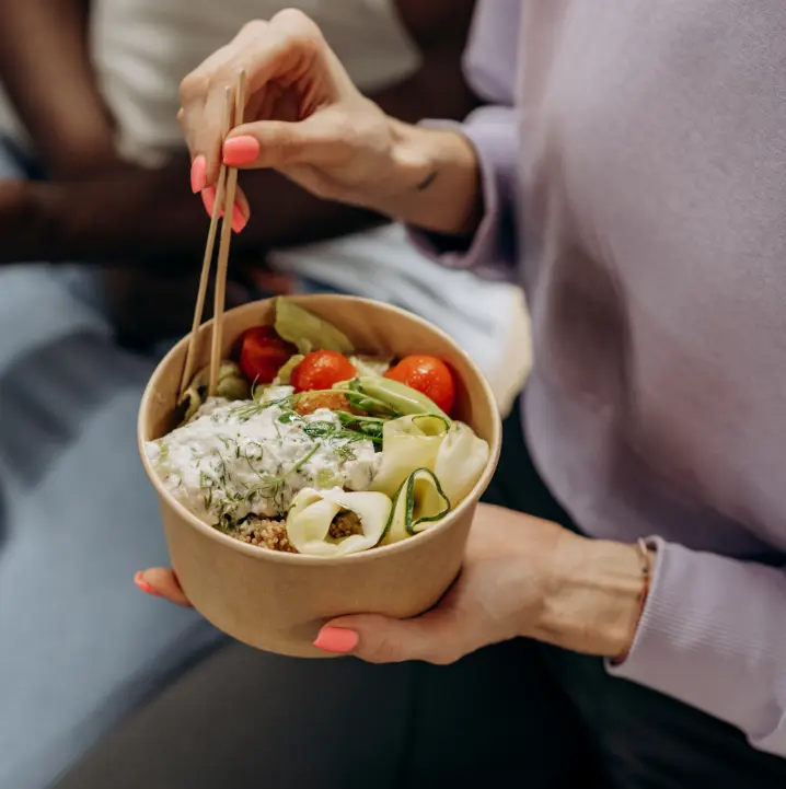 Woman with a bowl of meal prep