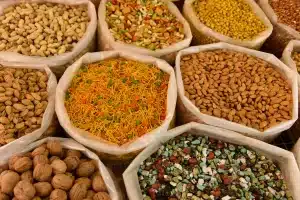 A group of bags of different types of nuts
